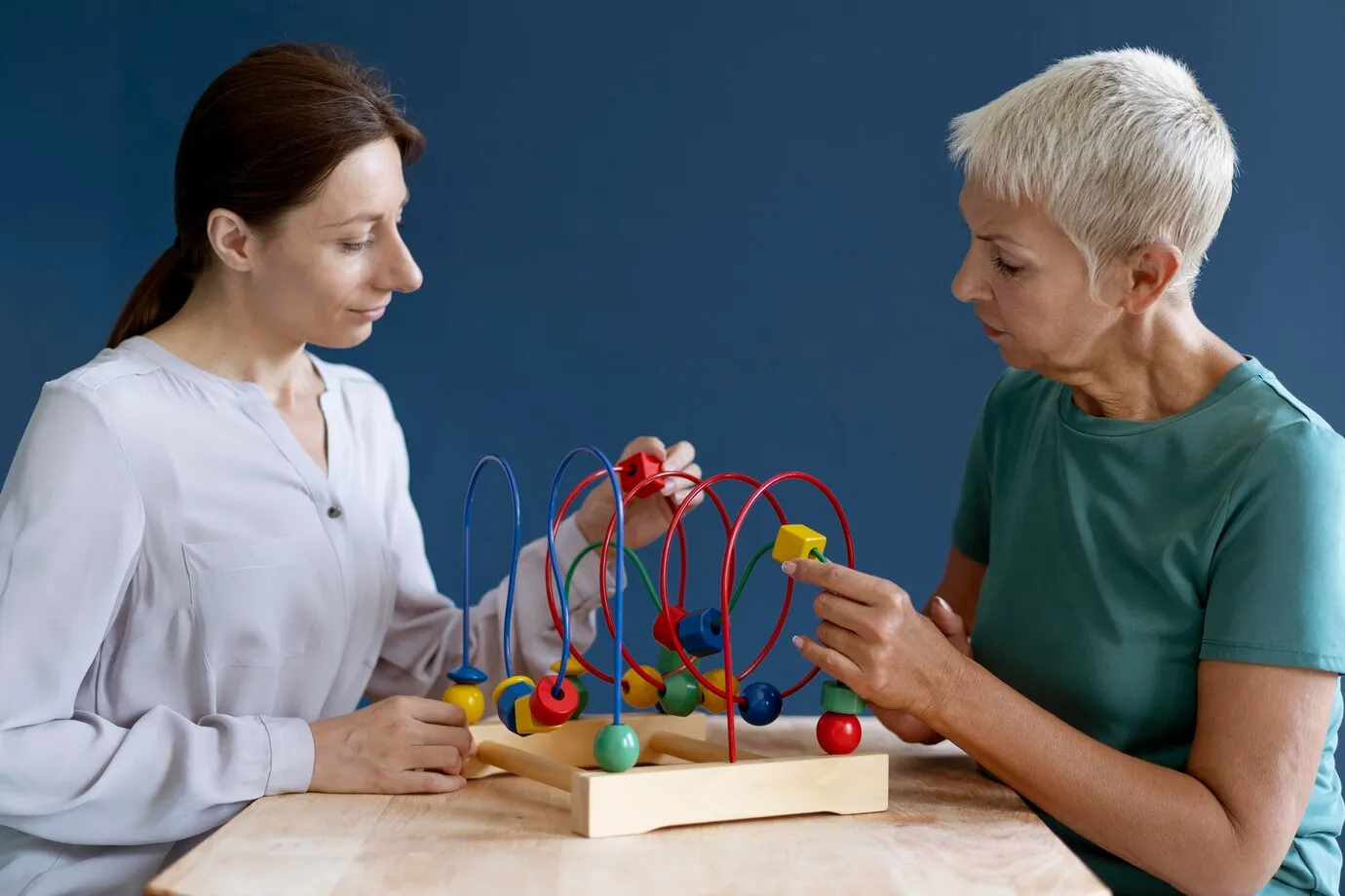 woman-doing-occupational-therapy-session-with-psychologist_23-2149091483 (1) (1)